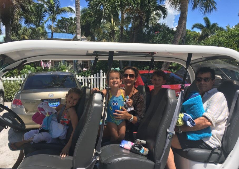 family in golf cart 
