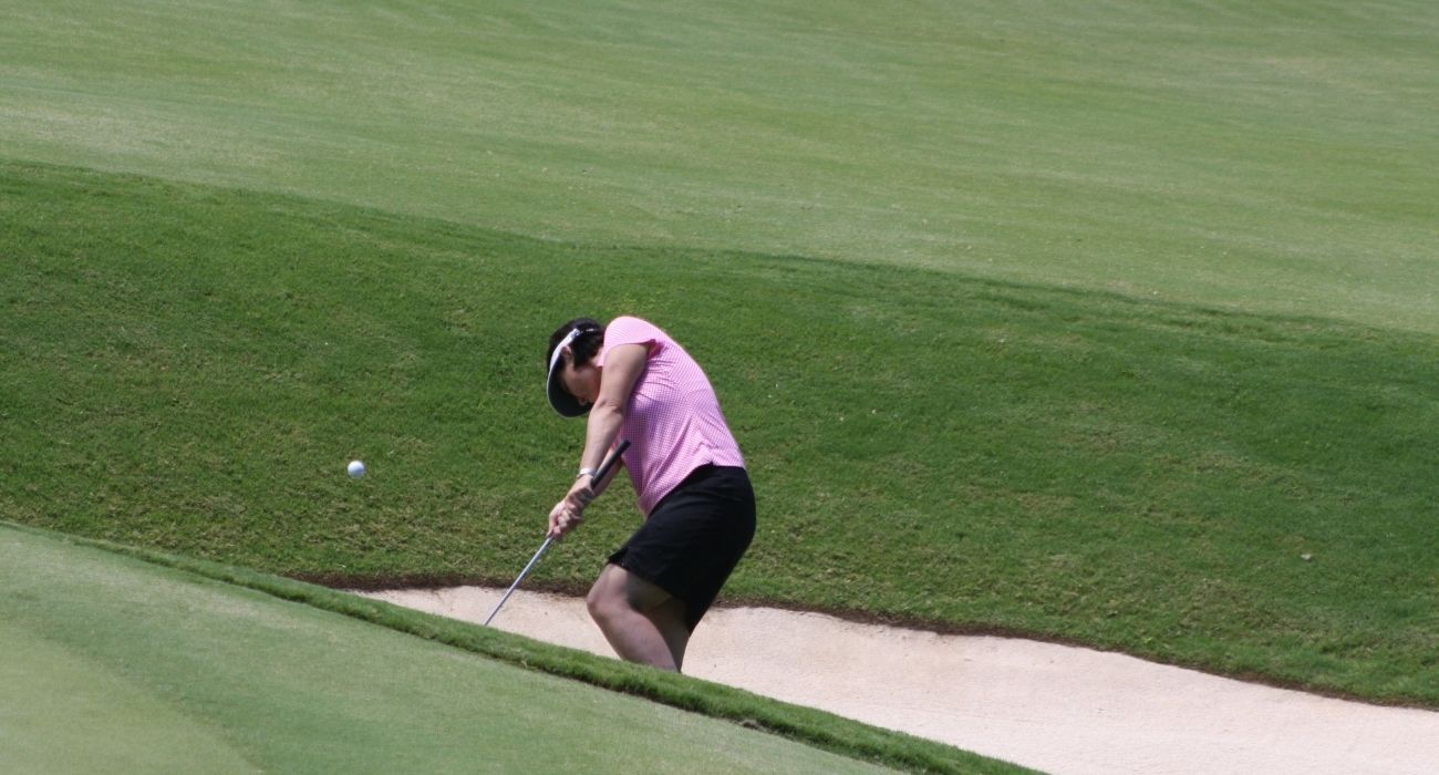 woman golfing on course
