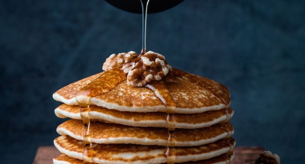 pancake stack with walnuts and syrup