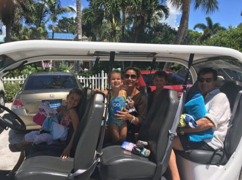 family on a golf cart