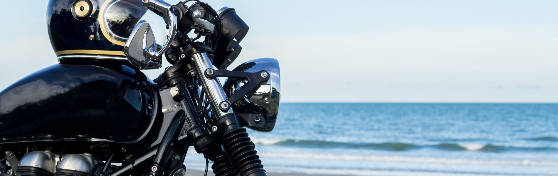 black motorcycle by the ocean