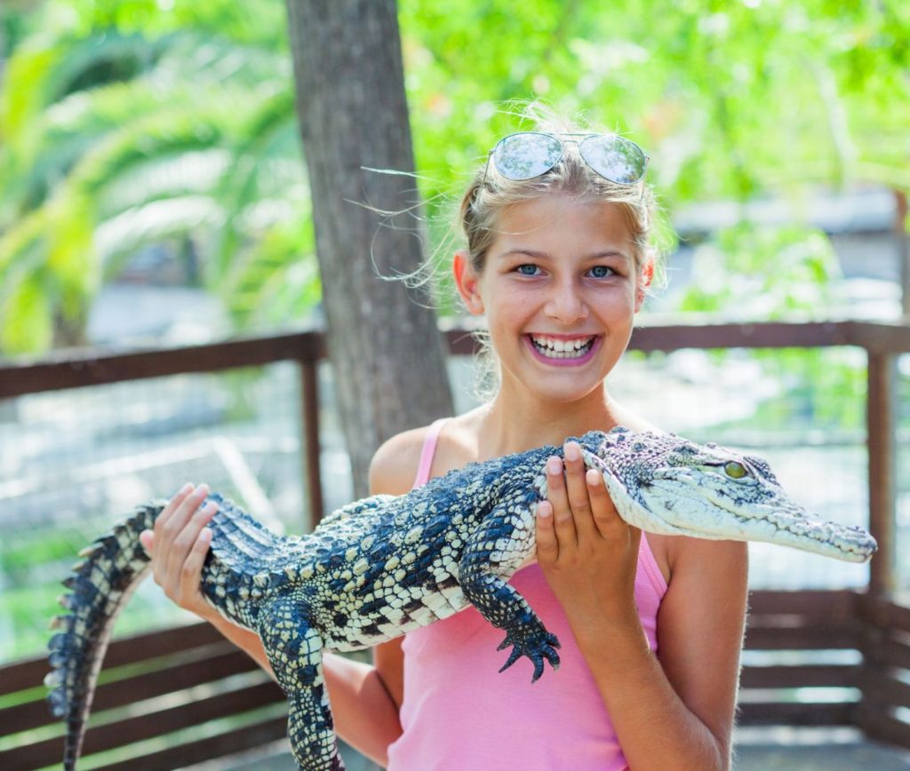 girl holding alligator at sarasota jungle gardens